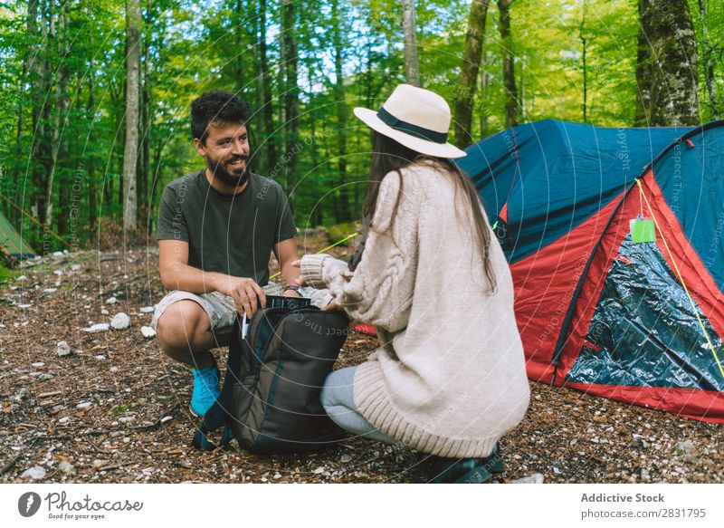 Couple in camp Forest Camping Vacation & Travel Backpack Sit Nature Happy Youth (Young adults) Adventure Man Woman Hiking Tourist Leisure and hobbies hiker
