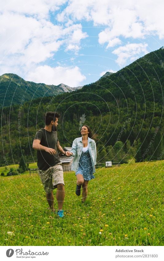 Couple on meadow in hills Meadow Hill holding hands Nature Summer Human being Man Woman Love Grass Beautiful Together Youth (Young adults) Happy Landscape
