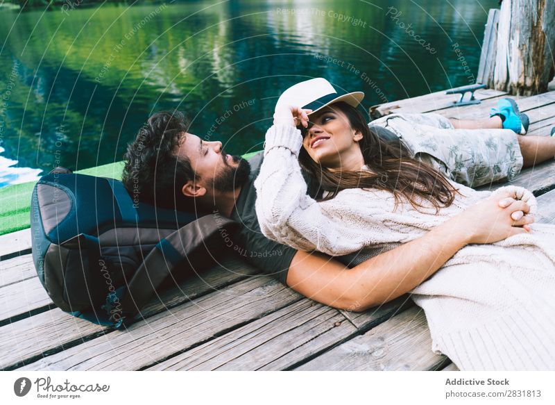 Couple lying at lake together Lake Human being Nature Vacation & Travel Jetty Love Summer Happy 2 Man Woman romantic Lifestyle Water Romance Beautiful