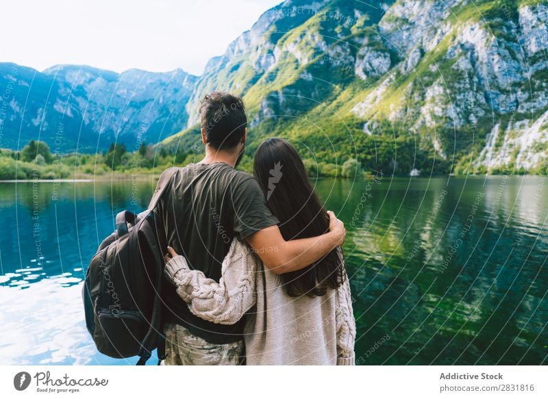 Couple embracing on pier Lake Human being Nature Vacation & Travel Jetty Love Summer Happy 2 Man Woman romantic Lifestyle Water Romance Beautiful