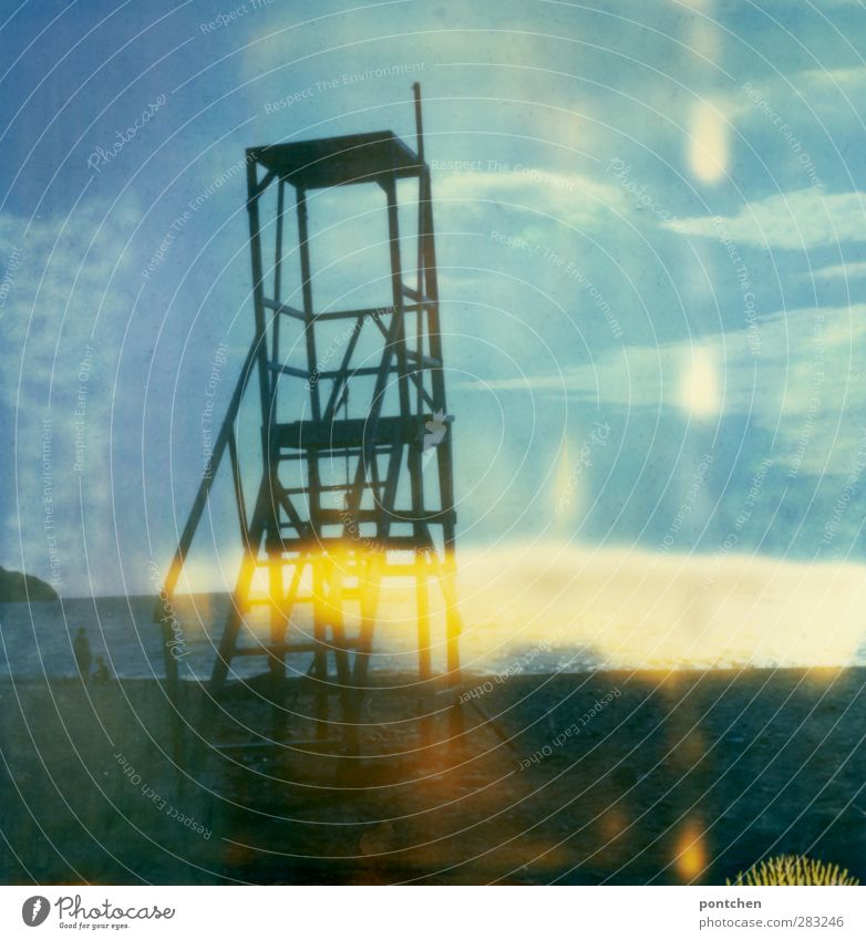 Polaroid. Surveillance tower on the beach. Man with dog looking at the sea. Security, freedom, recreation Beach Crete Manmade structures Blue To go for a walk