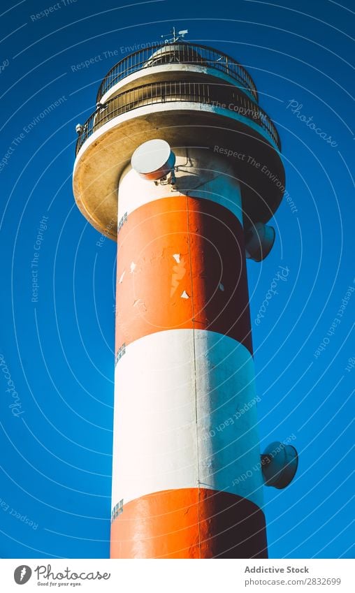 Colorful lighthouse on blue sky Lighthouse Tower Sky Multicoloured Coast Architecture Vacation & Travel Navigation Red White Nature Landscape Safety