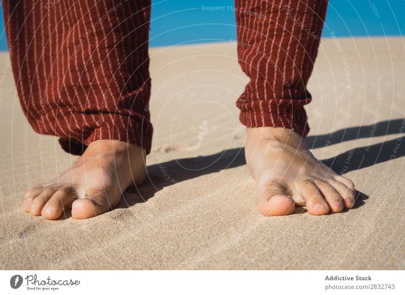 Crop male feet on rippled sand Man Sand Feet Barefoot Vacation & Travel Beach Nature Coast Stand Recklessness Consistency Dry Groove Legs Crops body part