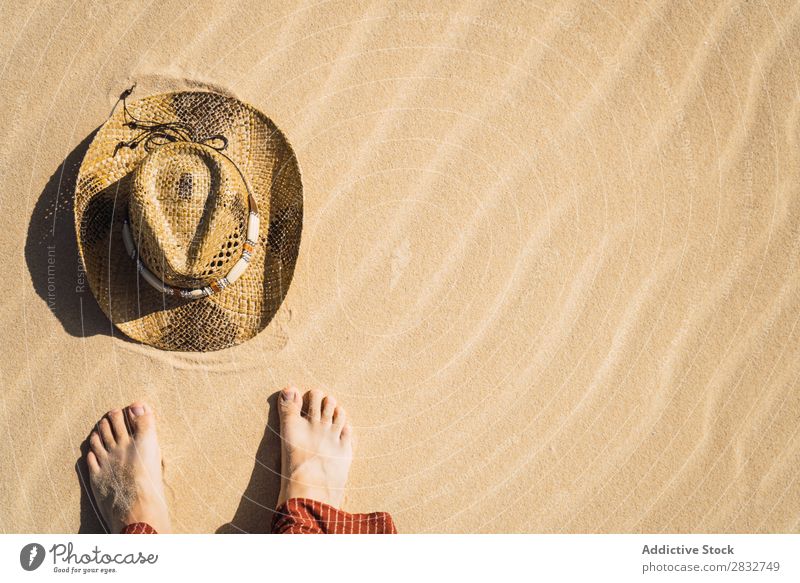 Barefoot man on sand with straw hat Man Sand Hat Groove Stand Cowboy Coast Vacation & Travel Beach enjoyment Compose Nature Legs Crops Headwear body part Resort