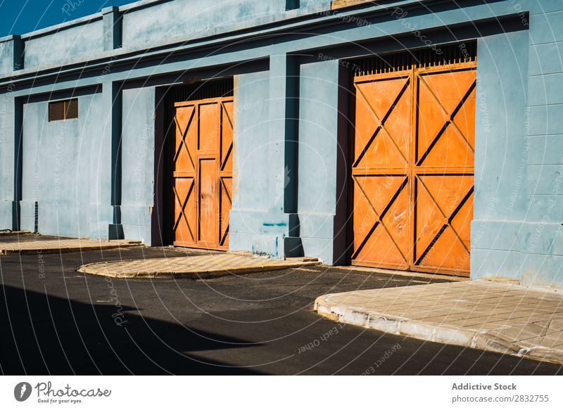 Orange gates in blue wall Exterior Gate Metal Building Consistency Wall (building) Multicoloured Entrance Colour House (Residential Structure) Bright Day