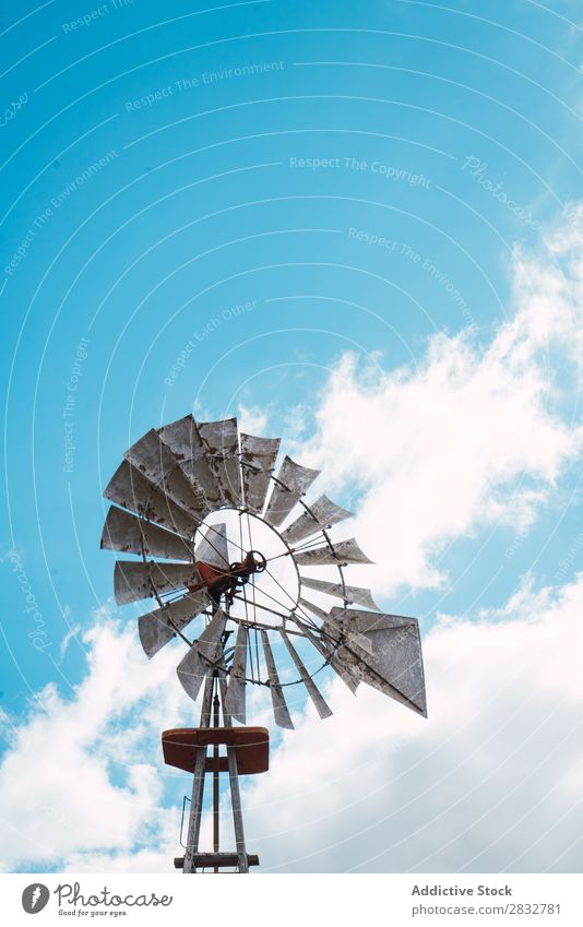 Rusty windmill on blue sky Windmill Old Metal Sky Agriculture Landscape Spin Energy Mill Rotation Nature Power Environment Rural Clouds Ranch Alternative