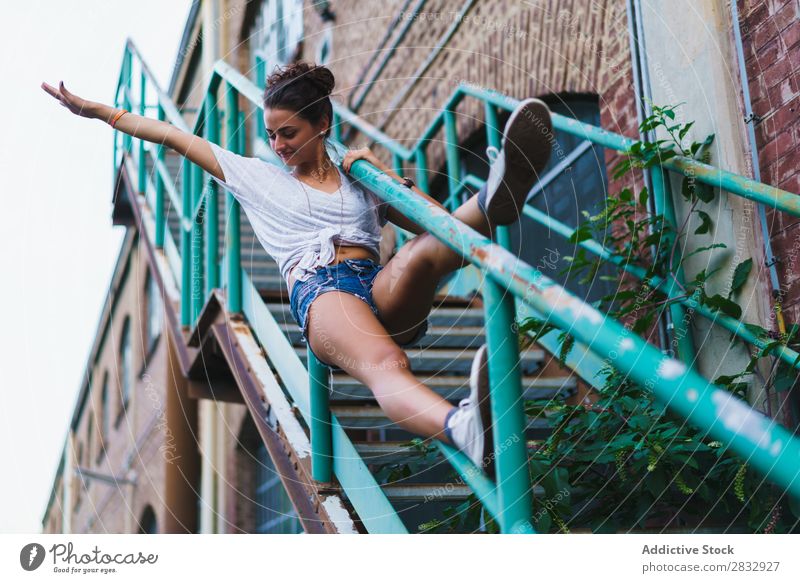 Woman posing on old stairway Fence Generation Balance Posture Cheerful Stairs artistic Youth (Young adults) Summer Self-confident youngster Sports Body