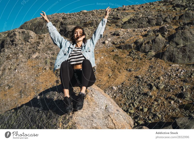 Woman sitting on stone in a rocky slope Rock Slope Nature Sunbeam Beautiful Attractive pretty Youth (Young adults) Thin Vacation & Travel Delightful Cute Day