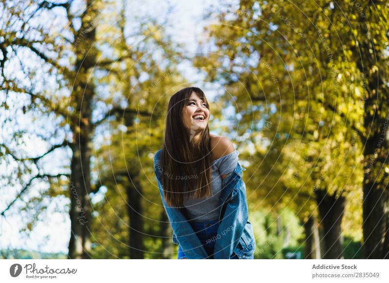 Cheerful woman walking in park Woman Park Autumn Walking Smiling pretty Nature Girl Lifestyle Seasons Yellow Leisure and hobbies Tree Youth (Young adults) Happy