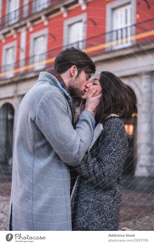 Young lovely couple kissing - a Royalty Free Stock Photo from