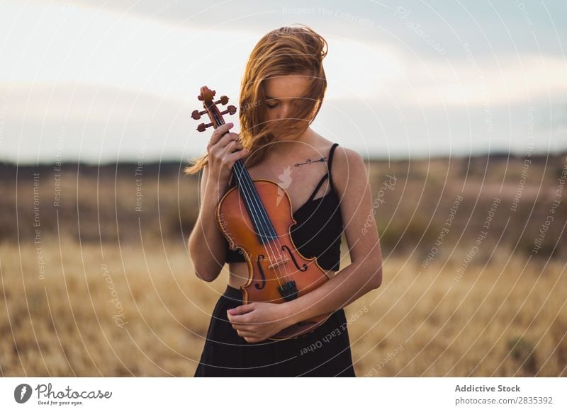 Pretty woman with violin on field Woman Violin Music Musician Art Violinist Classical instrument Beautiful Musical Player Performance pretty Field Dress