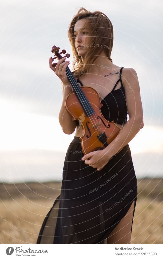 Pretty woman with violin on field Woman Violin Music Musician Art Violinist Classical instrument Beautiful Musical Player Performance pretty Field Dress