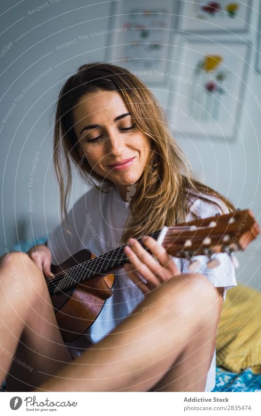 Young woman playing guitar Woman pretty Home Youth (Young adults) Musician Guitar Playing Acoustic Classic Posture Portrait photograph Beautiful Lifestyle