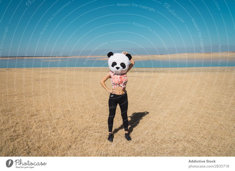 Woman with panda hat posing on nature Hat Creativity Panda Costume Traveling Nature Wear having fun Landscape Relaxation Wanderlust Artificial Style pose