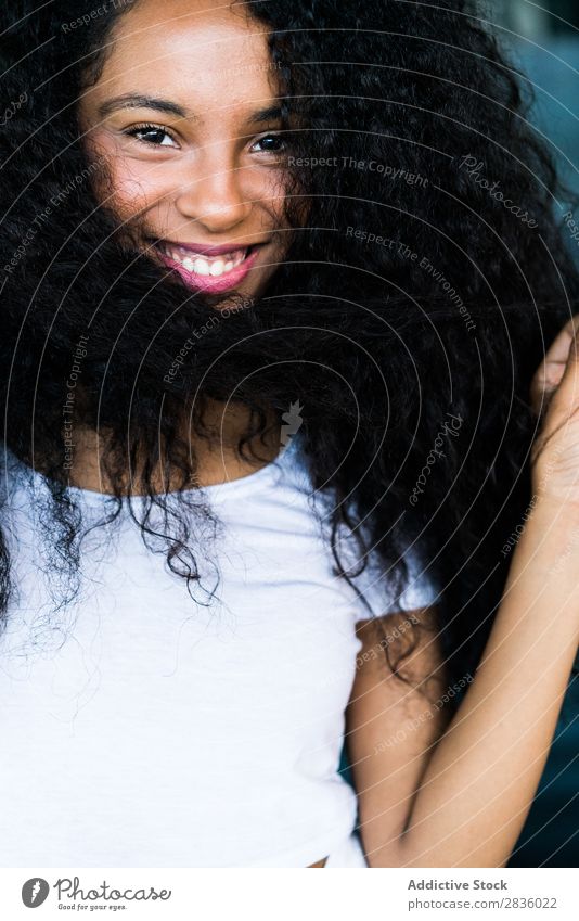 Woman playing with hair in mall pretty Youth (Young adults) Portrait photograph Looking into the camera Hair Playful Black African City Mall Town Head Beautiful