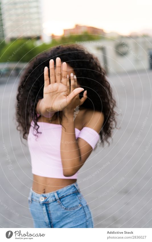 Woman gesturing stop pretty Youth (Young adults) closing face Stop Gesture Posture Portrait photograph Black African City Town Street Head Beautiful Curly