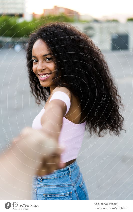 Woman holding photographer hand pretty Youth (Young adults) Portrait photograph follow me Gesture Photographer Hand Looking into the camera Black African City