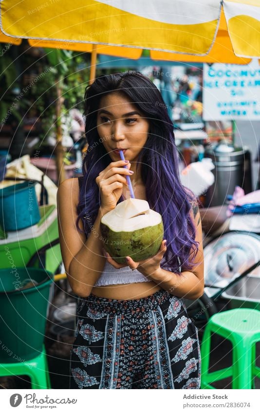 Asian woman drinking from coconut Woman pretty Street Youth (Young adults) Beautiful Portrait photograph Coconut Drinking Straw Hair Purple asian eastern