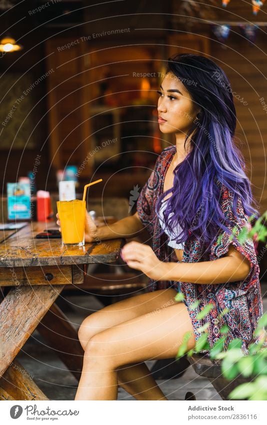 Woman with smartphone in cafe pretty Youth (Young adults) Beautiful Portrait photograph Juice Drinking PDA browsing Café Hair Purple asian eastern Fashion