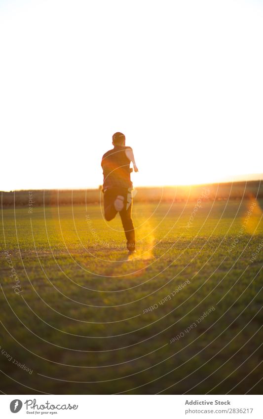 Man jumping on sunny field Field Joy Happiness Summer Freedom Nature Action Human being Youth (Young adults) Meadow Grass Energy Green Lifestyle Running