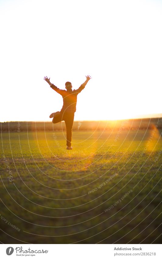 Man jumping on sunny field Field Joy Jump Happiness Summer Freedom Nature Action Human being Youth (Young adults) Meadow Grass Energy Green Lifestyle Running