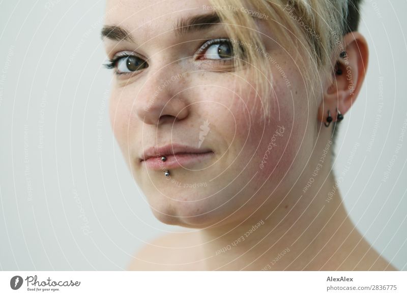 Young woman with freckles and short blonde hair looks sideways at camera Style pretty Face Life Flat (apartment) Youth (Young adults) Freckles 18 - 30 years