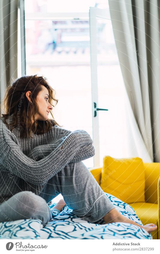 Young woman sitting and resting on bed Woman Home pretty Dream Bed Sit Looking away Youth (Young adults) Posture Relaxation Portrait photograph Beautiful