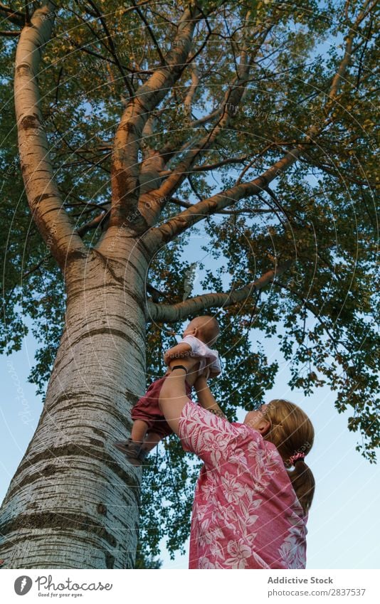 Woman showing tree to child Mother Child Park Tree Indicate Family & Relations Happy Human being Happiness Summer Lifestyle Love Parents Nature