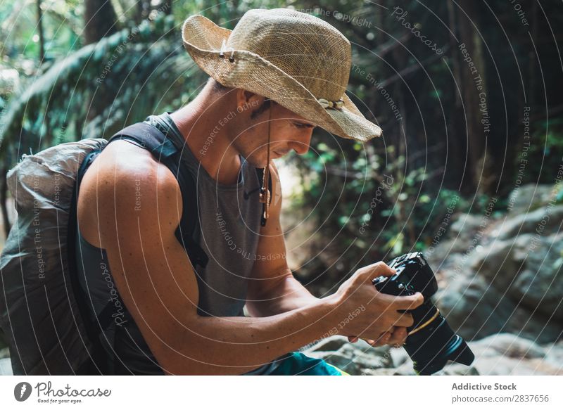 Handsome adult man setting camera Photographer Virgin forest Tourist Man Adults using Set Professional Vacation & Travel Forest Nature Tourism Landscape Natural