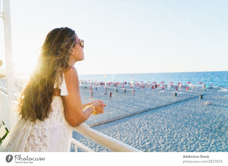 Woman enjoying beach view Beach Ocean Dream Traveling Posture Freedom daydreaming Fence Vacation & Travel seascape Lean Style Youth (Young adults) Tourism