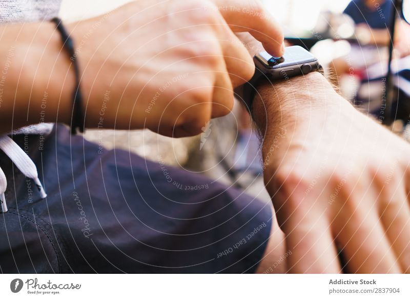 Crop man using electronic watch Man Observe Electronic smart watch Technology Digital Gadget Internet Modern Touch Decoration touchscreen Wireless Display Hand