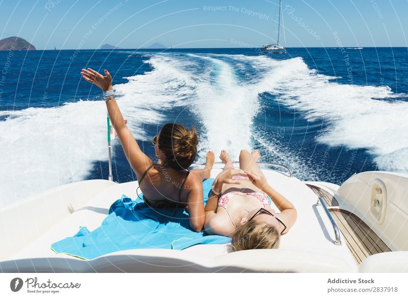 https://www.photocase.com/photos/2837918-women-relaxing-on-boat-woman-summer-having-fun-photocase-stock-photo-large.jpeg