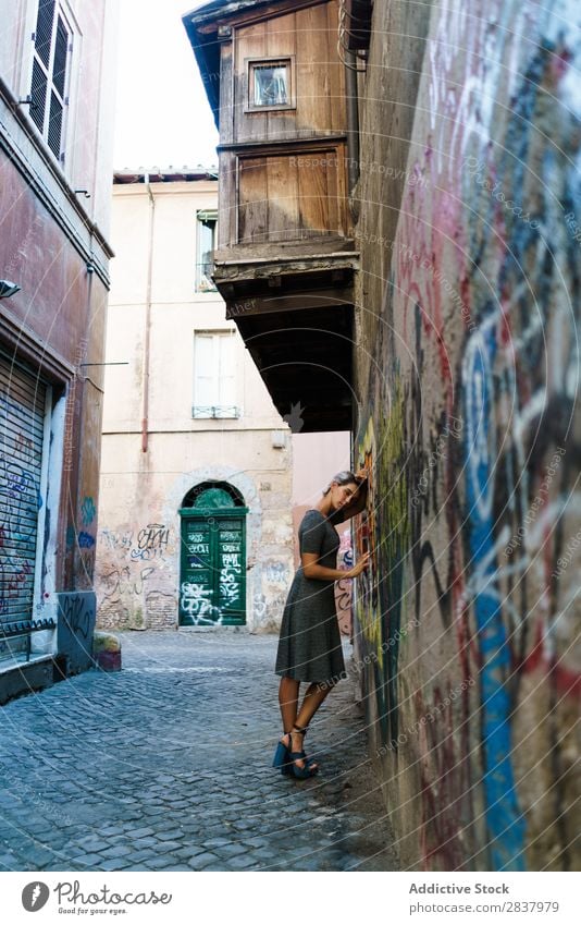 Smiling woman in alley Woman Alley Graffiti Wall (building) pretty Street Lifestyle Cheerful Calm Relaxation Blonde Walking Lovely Attractive Lady City