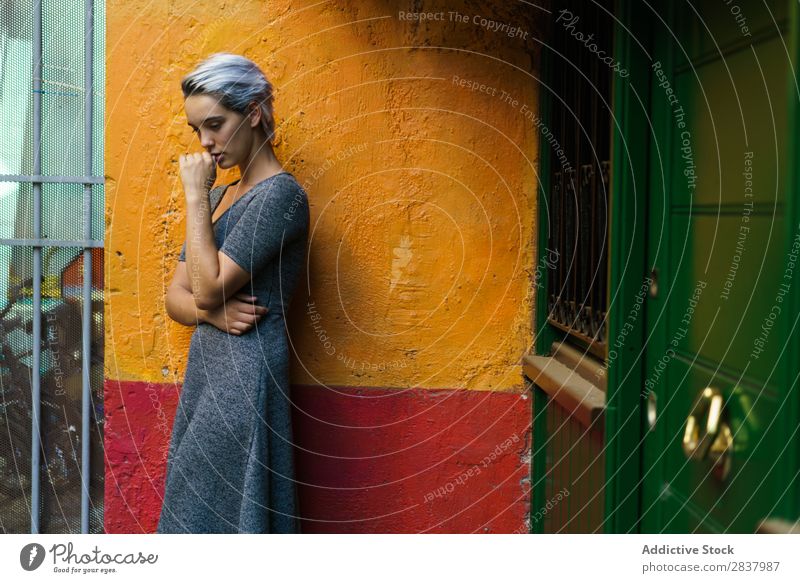 Woman posing in colorful wall - a Royalty Free Stock Photo from Photocase