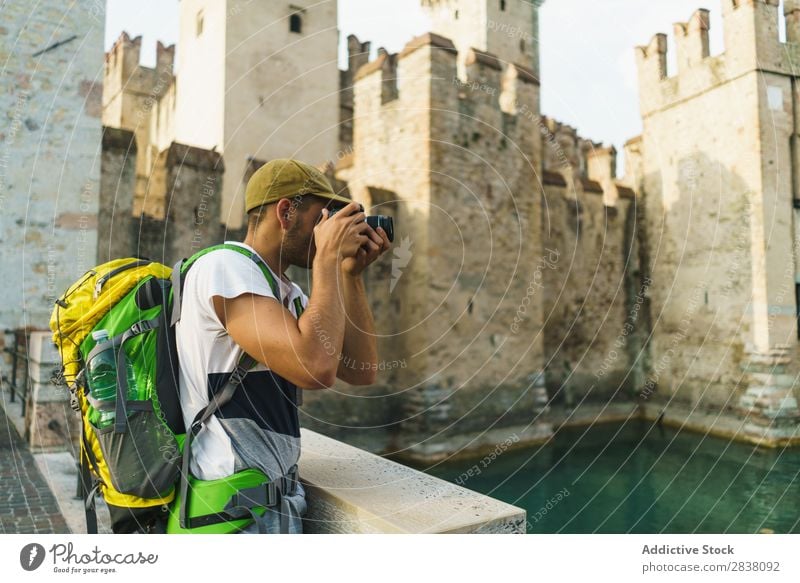 Tourist taking photo of sight Man Traveling backpacker Town Memory Photographer Castle City Lifestyle Technology Easygoing Photography Camera Summer