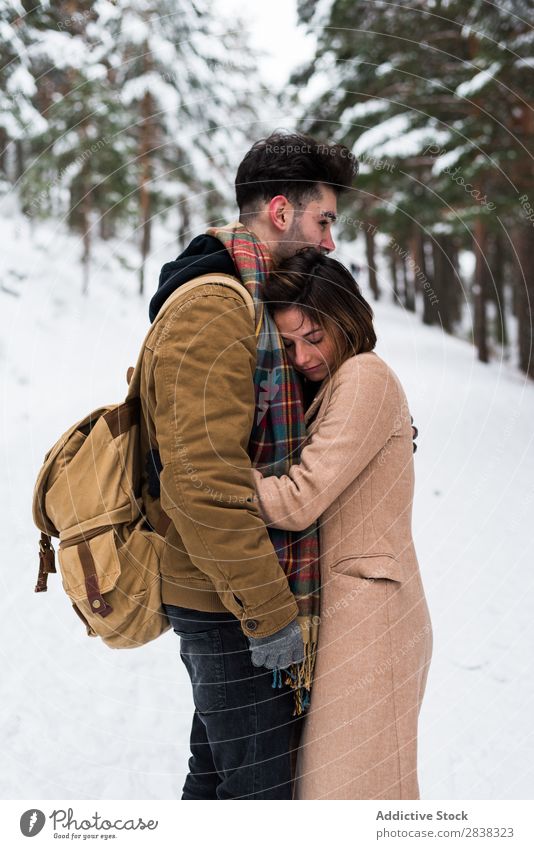 Couple embracing in forest Winter Forest Together Relationship Beautiful romantic Snow White Youth (Young adults) Love Romance Affectionate Family & Relations