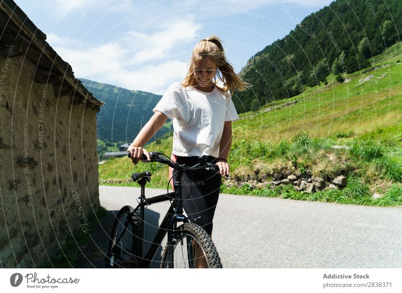 Pretty woman with bicycle Woman Athletic Bicycle Smiling Cheerful Sports Cycle Girl Action Lifestyle Cycling Human being workout Mountain Motorcycling