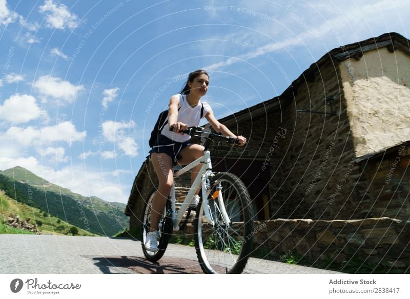 Woman riding bike Athletic Bicycle Cheerful Smiling Sports Cycle Girl Action Lifestyle Cycling Human being workout Mountain Motorcycling Relaxation Asphalt