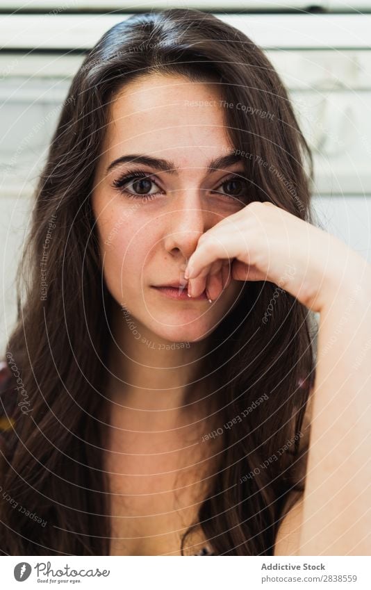 Gentle beautiful woman Woman Portrait photograph To enjoy Wonderful Hand on face Posture human face Brunette Natural Delicate Beauty Photography Lovely Style