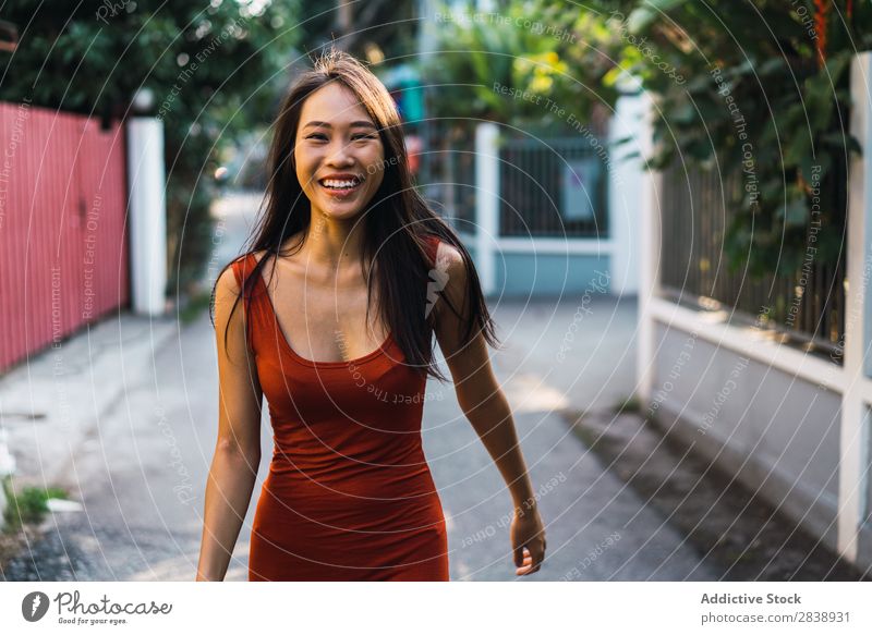 Cheerful woman posing on street Woman pretty asian Youth (Young adults) Happy Joy Street Green Town Beautiful Portrait photograph Attractive Beauty Photography