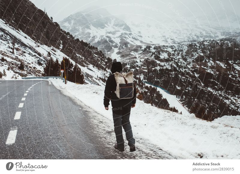 Man walking on snowy road Street Winter Hill Mountain Snow Landscape Nature White Ice Seasons Cold Vacation & Travel way Forest Frost Freeze Weather Rural