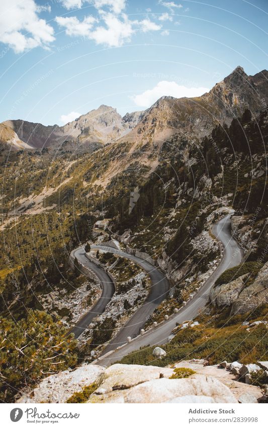 View of serpentine on mountain slope Mountain Slope roadway curvy Landscape Rural Dune Lanes & trails Transport Vacation & Travel Extreme Peaceful Valley