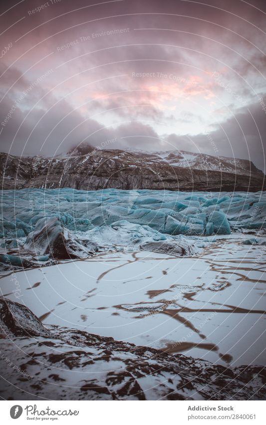 Silent frozen valley in rocky mountains Mountain Glacier Valley terrain Frost Holiday season Haze Environment Clouds Seasons Extreme Peace Winter Snow Fresh