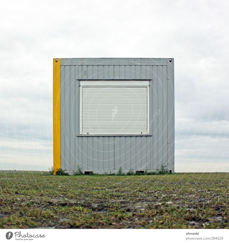 nothing going on Hut Building Site trailer Container Facade Window Venetian blinds Gray Reluctance Loneliness Horizon Colour photo Exterior shot Deserted