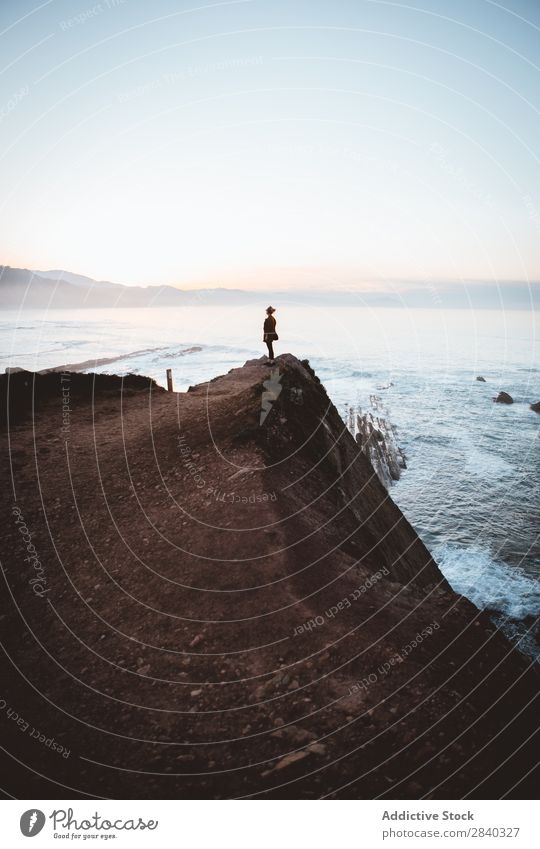 Person on cliff on seashore Human being Coast Calm traveler Landscape Vacation & Travel Silhouette Horizon Ocean Tourism Peaceful silence Stand Idyll Cliff