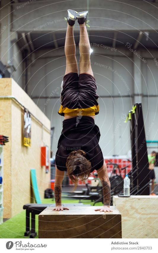 Premium Photo  Crossfit fitness dip ring man workout upside down at gym