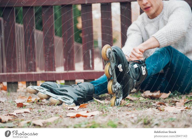 Young boy in the park Adults Autumn Attractive Background picture Boy (child) Brunette Easygoing Cool (slang) Cute Fashion Expression Expressive Flower Guy