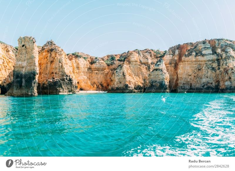 Ocean Landscape With Rocks And Cliffs At Lagos Bay Coast In Algarve, Portugal Nature Hole Cave Beach Stone Arch Window Vantage point Beautiful Vacation & Travel