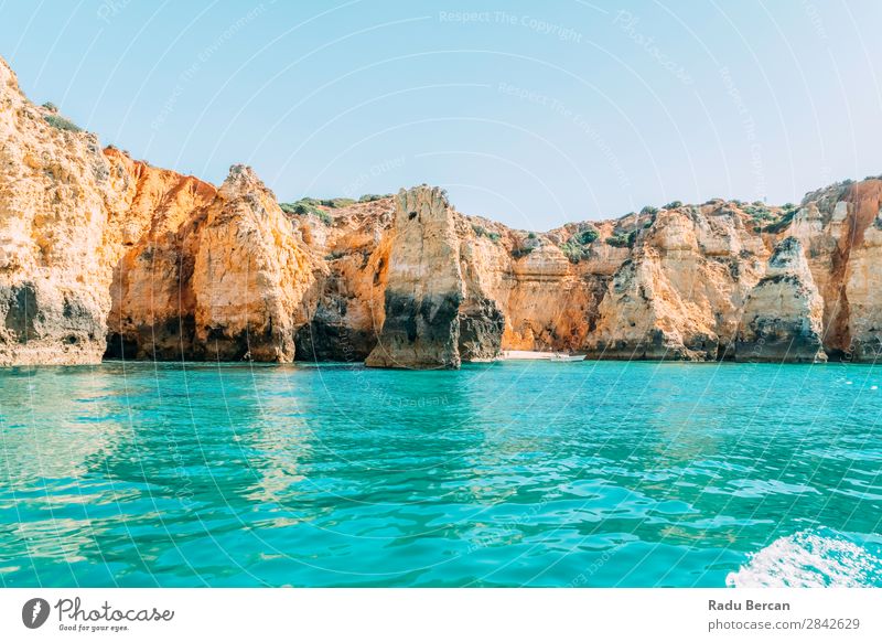 Ocean Landscape With Rocks And Cliffs At Lagos Bay Coast In Algarve, Portugal Nature Hole Cave Beach Stone Arch Window Vantage point Beautiful Vacation & Travel