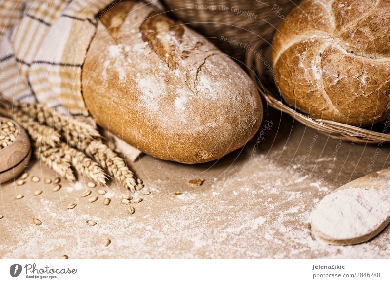 Freshly baked bread, wheat and flour on a rustic background Food Dough Baked goods Bread Nutrition Eating Breakfast Lunch Dinner Buffet Brunch Organic produce
